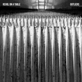Album cover of revol on a table